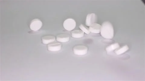 White pills scattered on the table Stock Footage 55821953