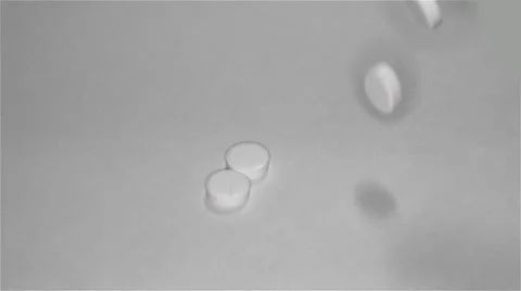 White pills scattered on the table Stock Footage 55821979
