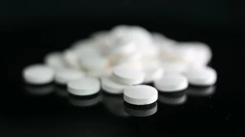 White Pills Slide Into Focus Stock Footage 232277493