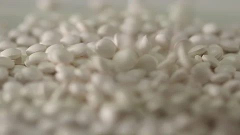 White pills on a turntable Stock Footage 249973673