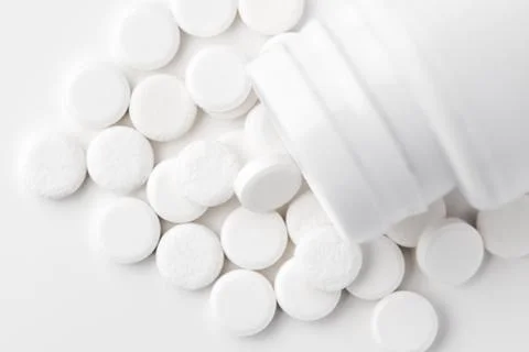 White pills on white background Stock Photos