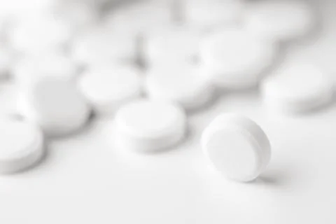 White pills on white background Stock Photos