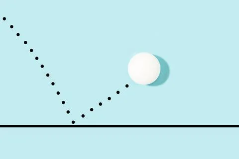 White ping pong ball bouncing on a light blue background Foto stock