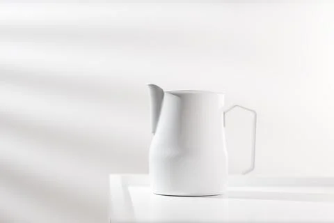 White pitcher. Stock Photos