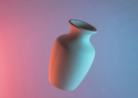White plain ceramic vase air against colored blue pink backdrop. High quality Stock Photos