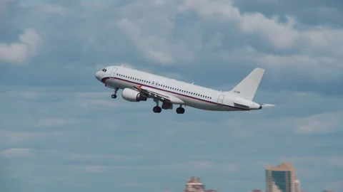 White plane took off in the blue sky Stock Footage 92199077