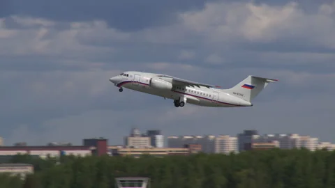 White plane took off in the blue sky Stock Footage 92199184