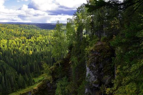 White, plaster, moss-covered sheer cliffs of Usvinskie Stolby (Perm Territory Stock Photos