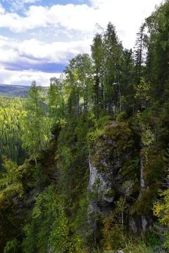 White, plaster, moss-covered sheer cliffs of Usvinskie Stolby (Perm Territory Stock Photos