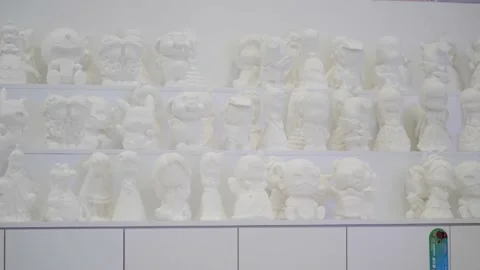 White plaster statues made by children in the children's entertainment area of t Stock Footage 157853635
