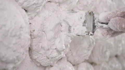 White plaster is used to cover the decorative elements and give them a finished Video stock 293728901