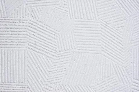 White plaster wall background with abstract decorative pattern Stock Photos