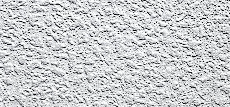 White plaster wall background. Texture of a white wall. Stock Photos