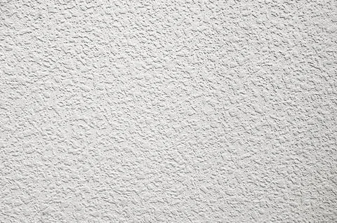 White plaster wall background. Texture of a white wall. Stock Photos