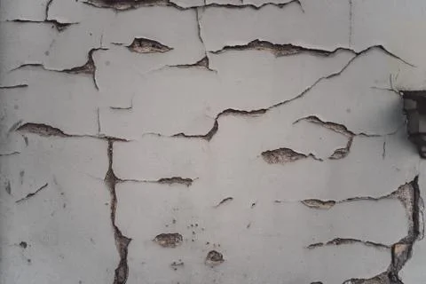 White plaster wall with cracks Stock Photos