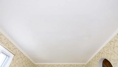 White plastered ceiling in a spacious hall Stock Photos