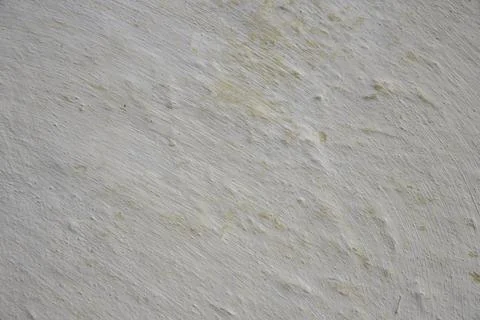 White plastered wall texture with subtle yellow undertones Foto stock