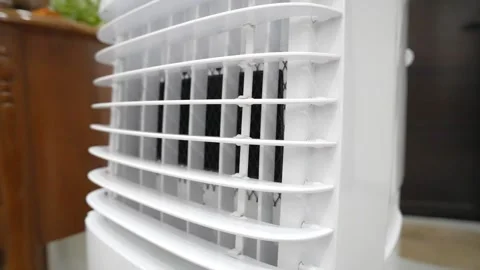 White plastic air conditioner or cooler vent with protective black mesh grille. Vidéo 334733847