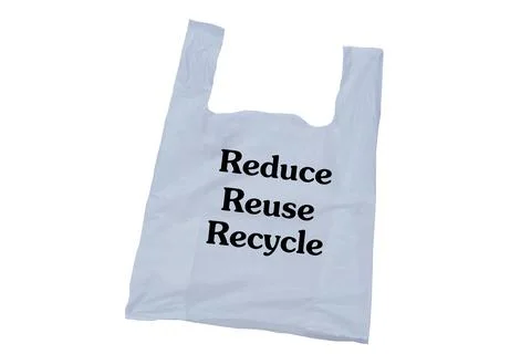 White plastic bag with text "Reduce Reuse Recycle." isolated on white background Stock Photos
