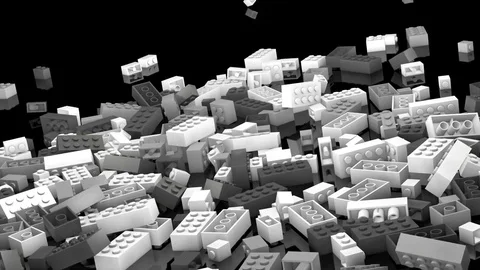 White plastic blocks tumbling into a pile Stockbeeldmateriaal 83925608