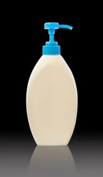 White plastic bottle on black background with clipping path Stock Photos