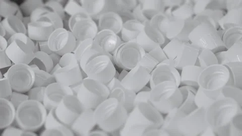 White plastic bottle caps. Production of liquid in plastic bottles. Stock Footage 306575866