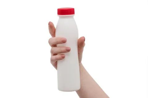 White Plastic Bottle isolated on white background. Hand with milk bottle Stock Photos