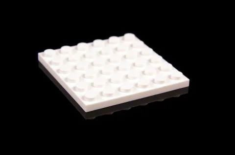 White plastic brick from toy constructor Foto stock