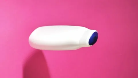 White plastic can rotates on a pink background Stock Footage 227600921