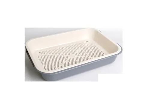 White plastic cat litter tray with grid for easy cleaning Stock Photos