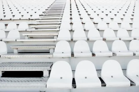 White plastic chairs in rows Stock Photos