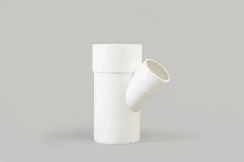 White plastic connection pipe on a gray background with copy space Foto stock