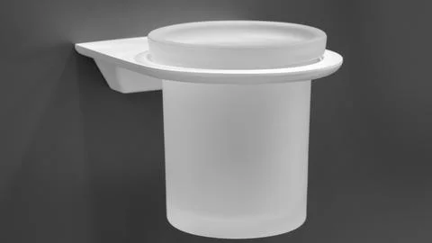 A white plastic container with a clear lid sits on a grey wall. The container Stock Photos