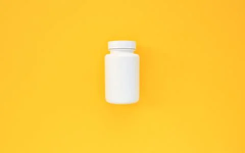 White plastic container for tablets on yellow background with copy space Stock Photos
