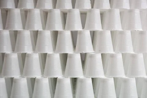 White plastic cups White plastic cups are seen stacked. Most disposable pl... Stock Photos