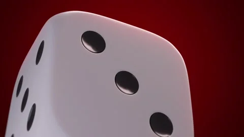 White plastic dice macro close up view. Infinite rotation. Red background Stockbeeldmateriaal 160259514
