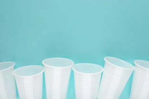 White plastic empty cups laid out in a row Stock Photos