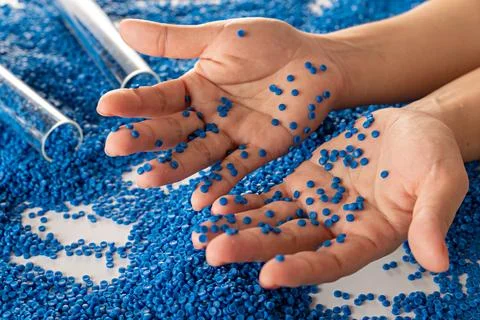 White plastic grain, plastic polymer granules,hand hold Polymer pellets, Ra.. 写真素材