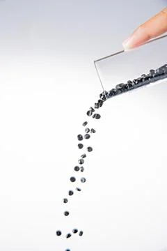 White plastic grain, plastic polymer granules,hand hold Polymer pellets, Ra.. 写真素材