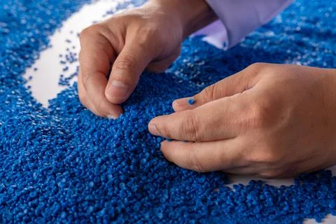 White plastic grain, plastic polymer granules,hand hold Polymer pellets, Ra.. 写真素材