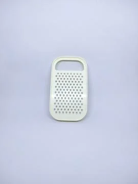 White plastic grater on isolated background Stock Photos