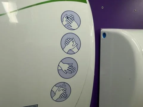 White plastic hand soap dispenser guide macro Stock-Fotos