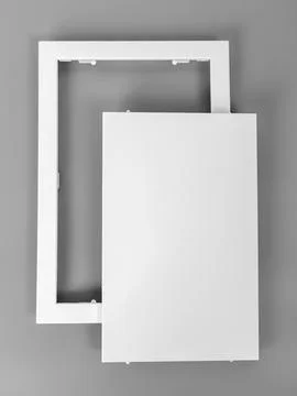 White plastic hatch on a gray background. Rectangular shape. Door for access  Stock Photos