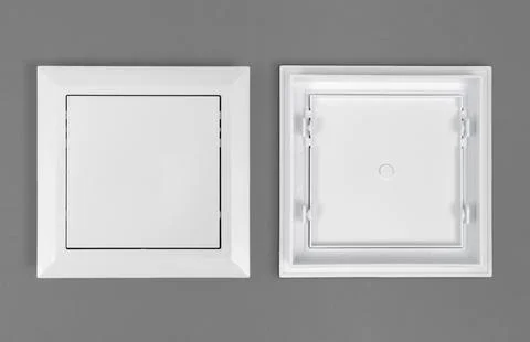 White plastic hatch on a gray background. Square shape. Top view. Stock Photos