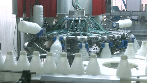 White plastic milk bottles on the conveyor on a modern dairy plant. Stock Footage 313225147