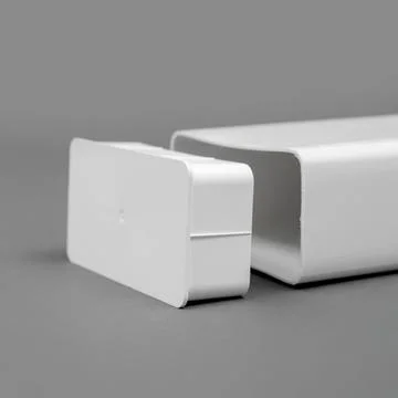 White plastic pipe with a plug on a gray background. Rectangular shape. Stock Photos