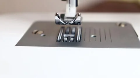 White plastic sewing machine,sewing machine foot and needle Stock Photos