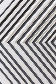 White plastic slats forming a repeating diagonal pattern Stock Photos