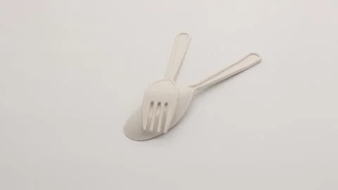 White plastic spoon and fork isolated Stock Photos