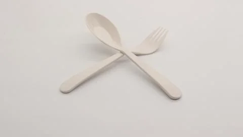 White plastic spoon and fork isolated Stock Photos